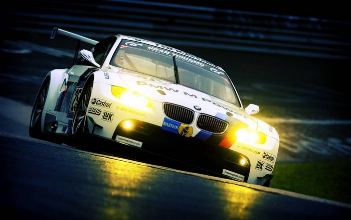BMW M Power race car on a wet track