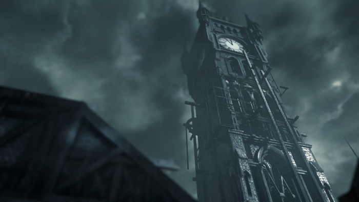 Clock tower under a cloudy sky