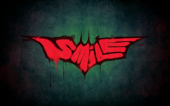 The Joker's Smile Graffiti on Batman Symbol