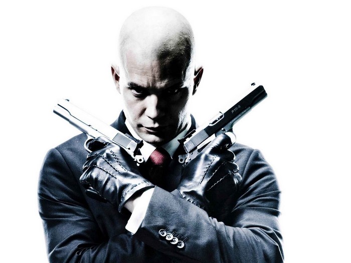 Agent 47 from Hitman holding two pistols