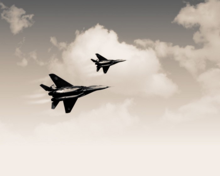 Two MiG-29 fighter jets flying in formation