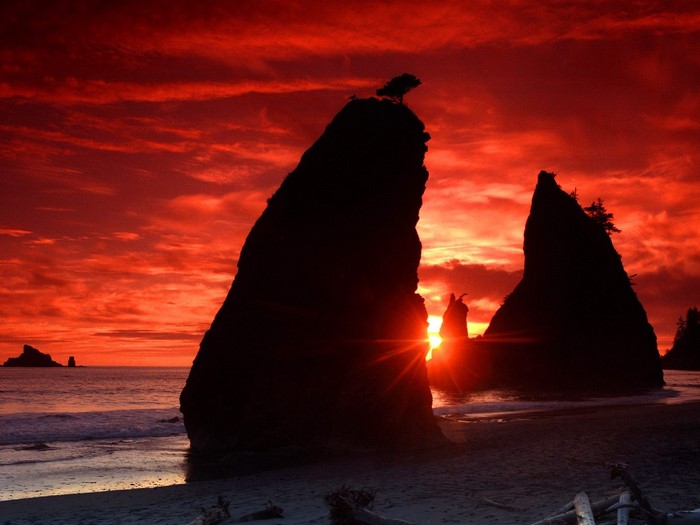 Dramatic Sunset Over Rocky Coastline