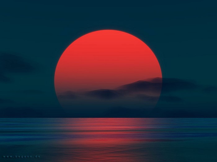 Red Sun Setting Over Ocean