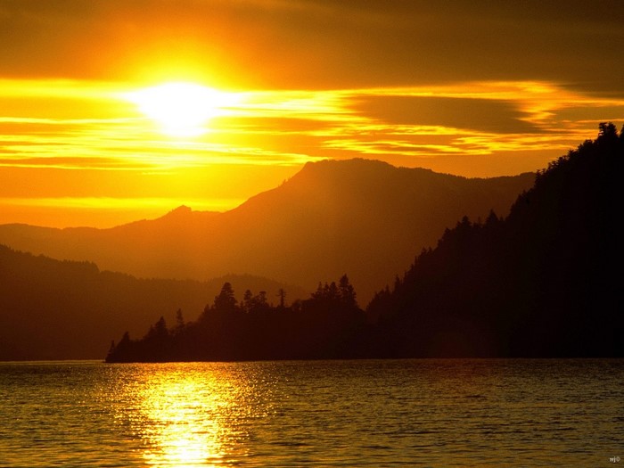 Sunset over mountains and lake