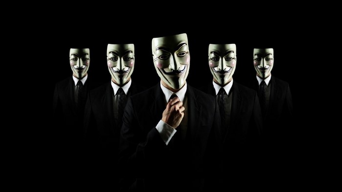 Group of people wearing Anonymous masks