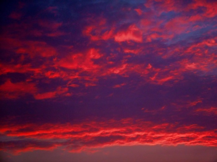 Dramatic red and purple clouds at sunset
