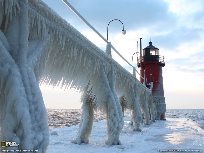 Icy Winter Lighthouse by the Sea