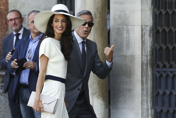 Amal Alamuddin and George Clooney at a wedding