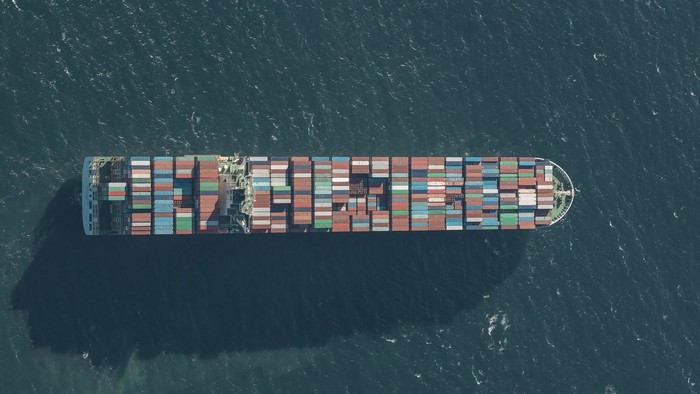 Aerial view of a large container ship sailing on the sea