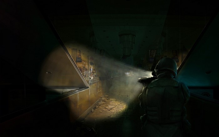 Soldier with flashlight in dark, ruined hallway
