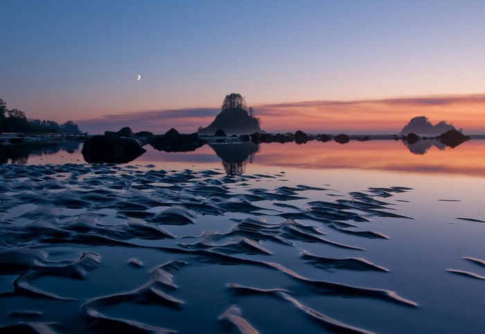 Beach at Dusk with Moon and Sunset Reflection