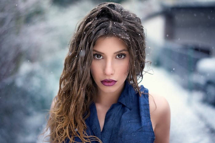 Woman with long brown hair in the snow