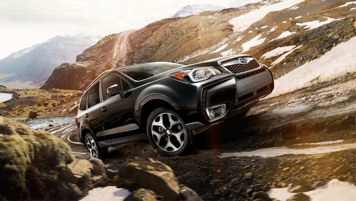 Black Subaru Forester off-roading on a rocky mountain trail