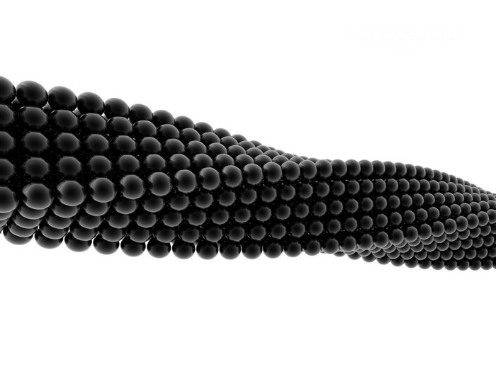 Abstract pattern of black spheres in a wave