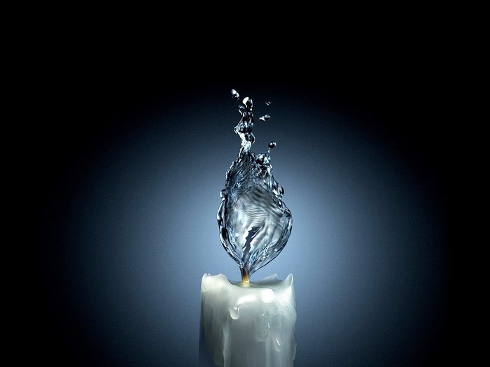 Water splash resembling flame on a candle