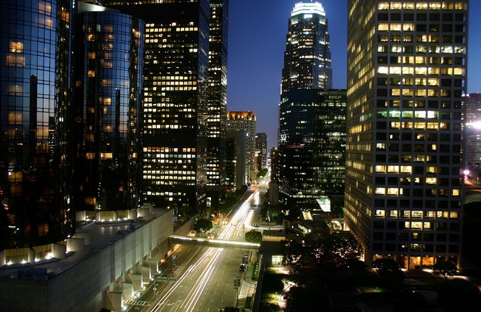 Downtown Los Angeles cityscape at night with light trails
