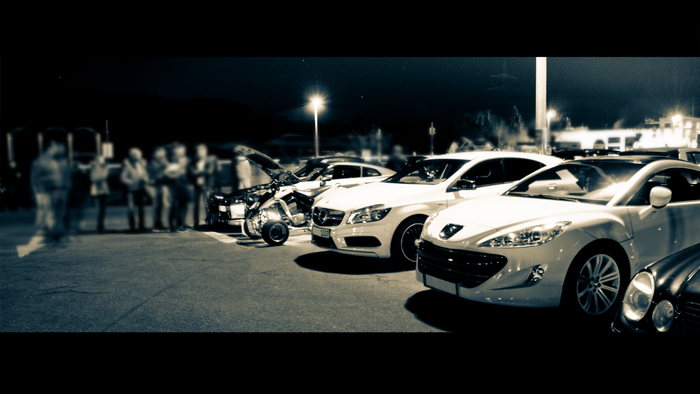 Cars and people at night