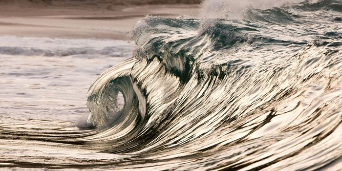 Close up of a powerful ocean wave crashing