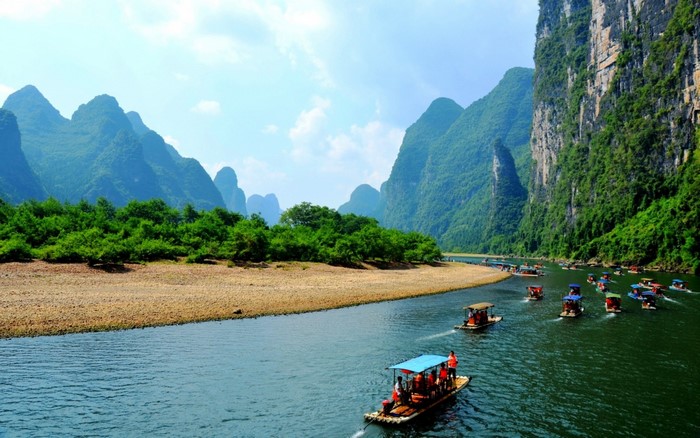 Boats on the Li River in China with Karst Mountains