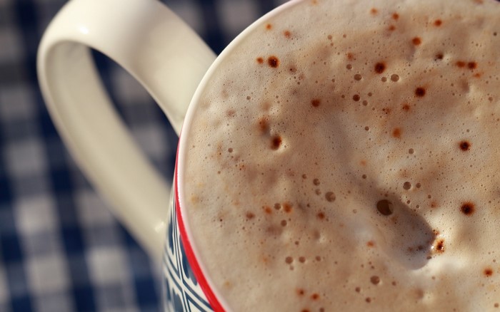 Close-up of a frothy coffee in a mug