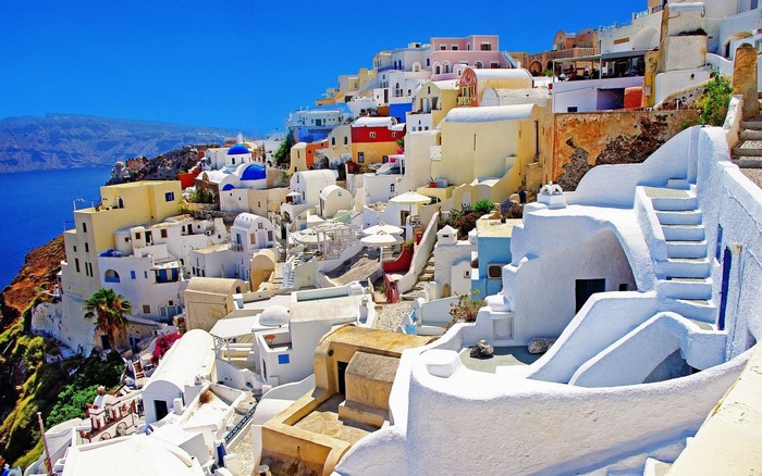 Santorini, Greece: Whitewashed village on a cliff overlooking the sea