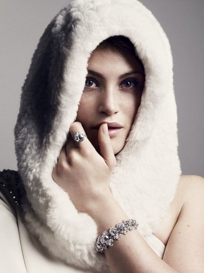 Gemma Arterton wearing a fur hood and jewelry