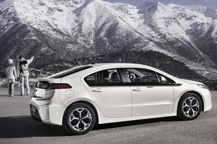 White Opel Ampera electric car in snowy mountains