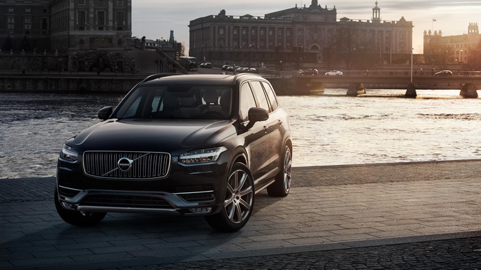 Black Volvo XC90 SUV parked by a river in Stockholm