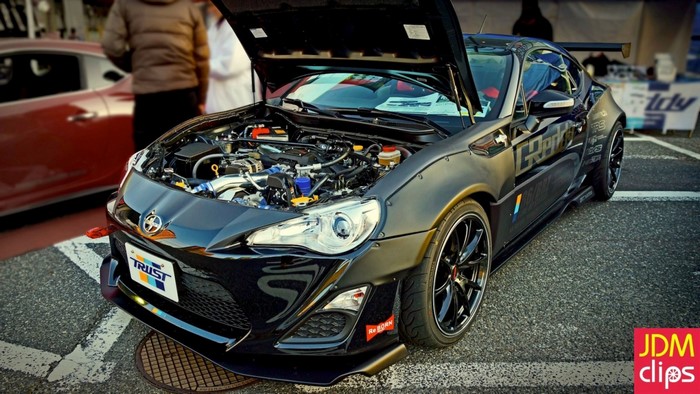 Black Scion FR-S with open hood and custom body kit