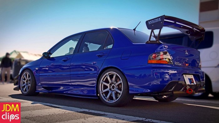 Blue Mitsubishi Lancer Evolution IX with Voltex wing