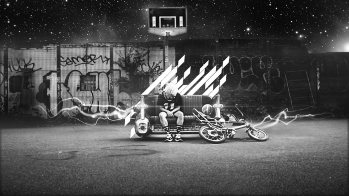 G-Dragon on a couch with a BMX bike