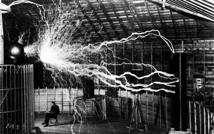 Nikola Tesla in his laboratory with a Tesla coil
