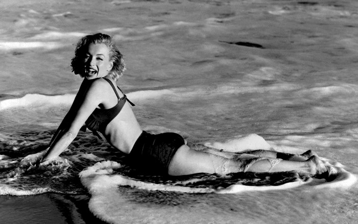 Marilyn Monroe Relaxing on the Shore in Black and White
