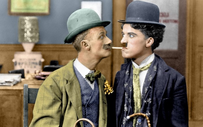 Charlie Chaplin and another man in hats