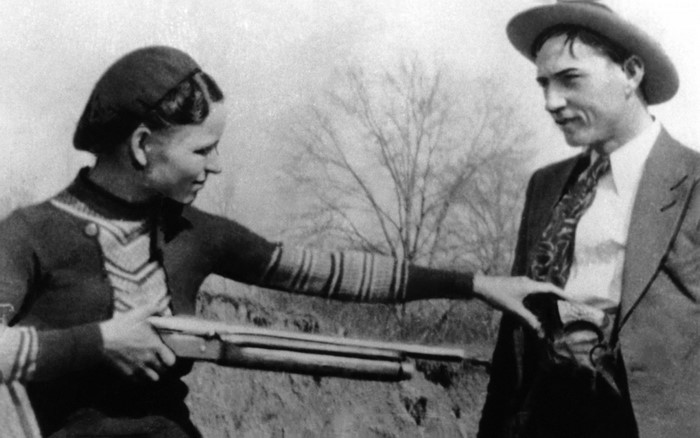 Bonnie Parker and Clyde Barrow with a shotgun
