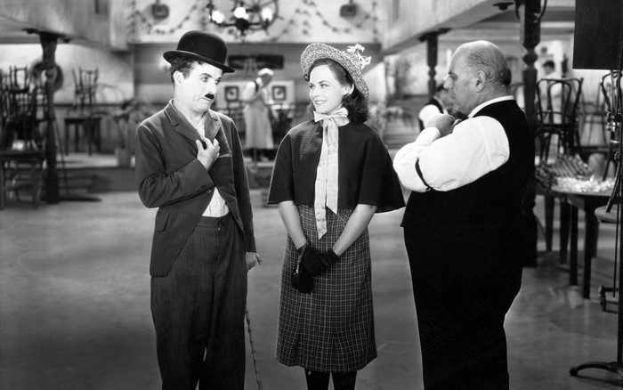 Charlie Chaplin and two others in a film still
