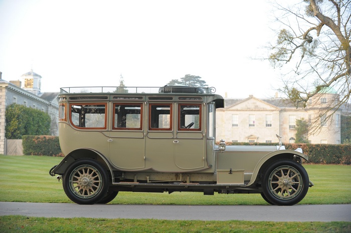 Rolls-Royce Silver Ghost vintage car parked in front of a mansion