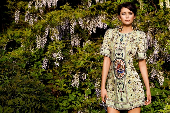 Nina Dobrev in a green embroidered minidress outdoors