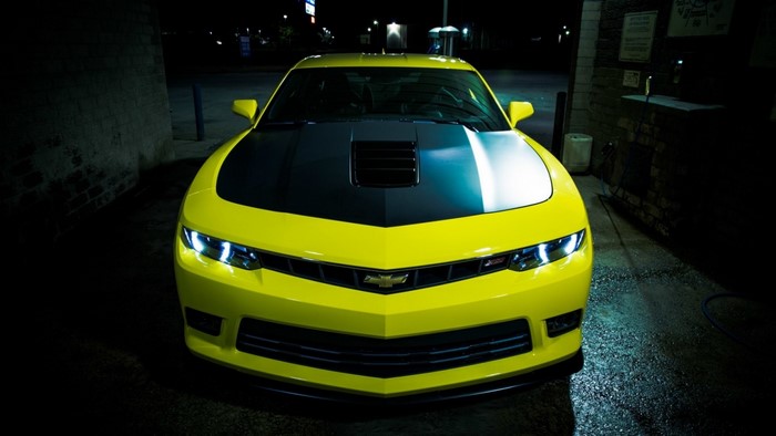 Yellow Chevrolet Camaro with black hood details