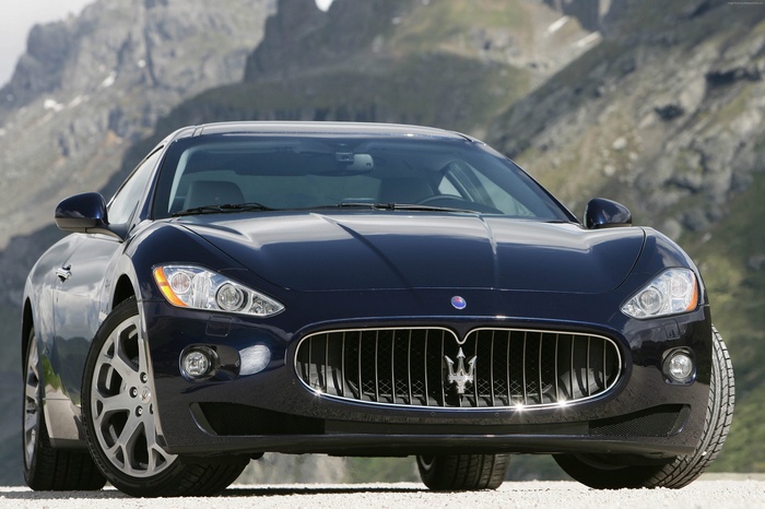 Maserati GranTurismo parked in a mountainous landscape