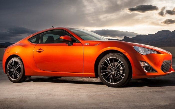 Orange Toyota 86 sports car parked outdoors