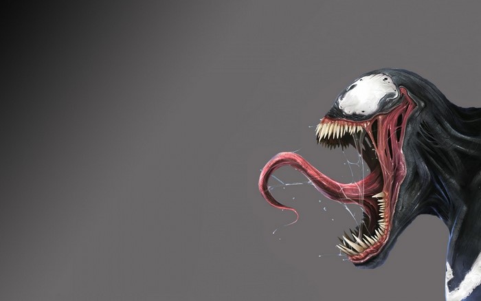 Venom with tongue out on gray background