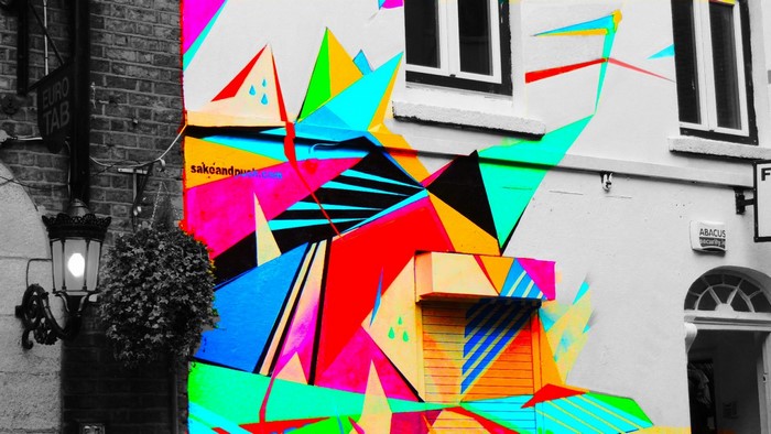Graffiti mural with selective coloring on a building in Dublin