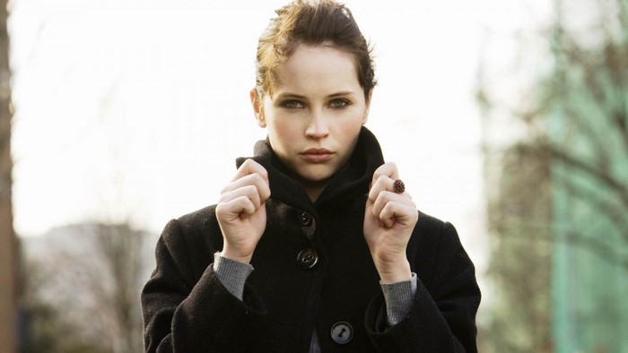 Felicity Jones in a black coat