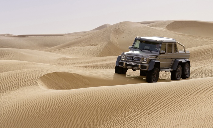 Mercedes-Benz G 63 AMG 6x6 driving in desert dunes