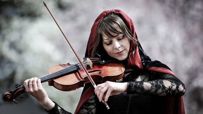 Woman in red hood playing violin