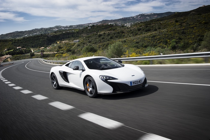 White McLaren 650S Sports Car on a Winding Road
