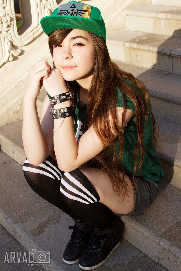 Girl wearing a green hat and knee-high socks