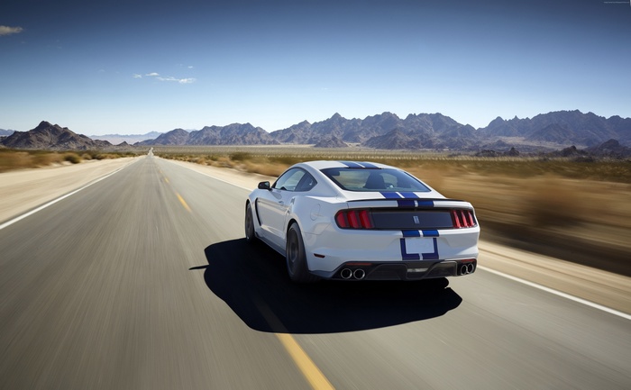 White Ford Mustang Shelby GT350 on desert road