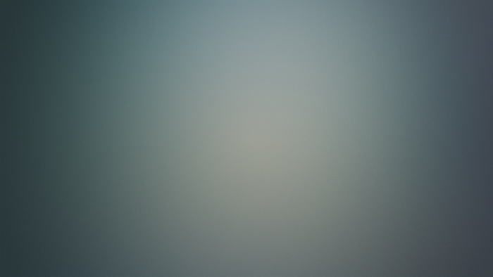 Blurred blue and gray gradient with light flare